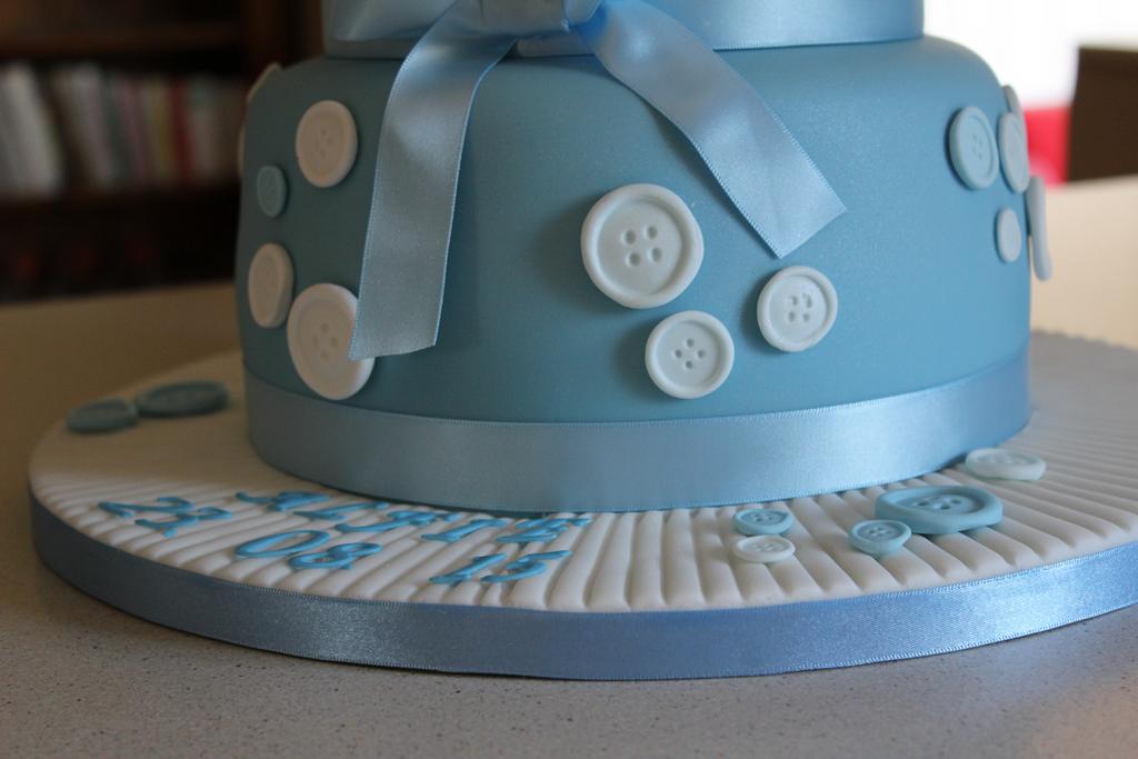Blue button christening cake