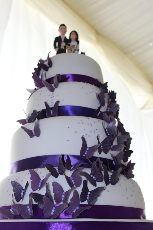 Cascading purple butterly wedding cake