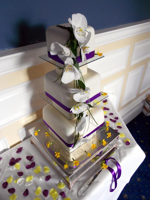 Fresh orchid wedding cake
