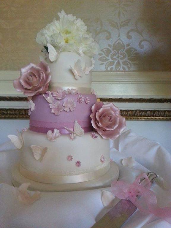 Pink rose and blossom wedding cake