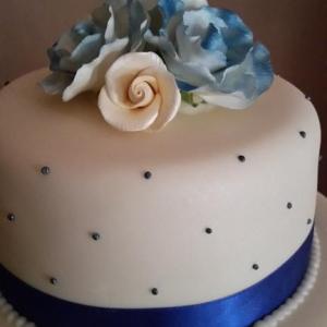 Navy and cream roses wedding cake