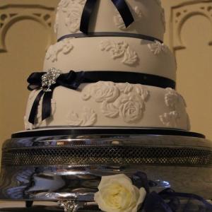 Navy and white lace wedding cake