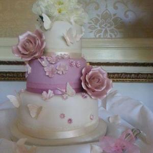 Pink rose and blossom wedding cake