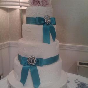 Turquoise and lace wedding cake