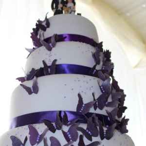 Cascading purple butterly wedding cake